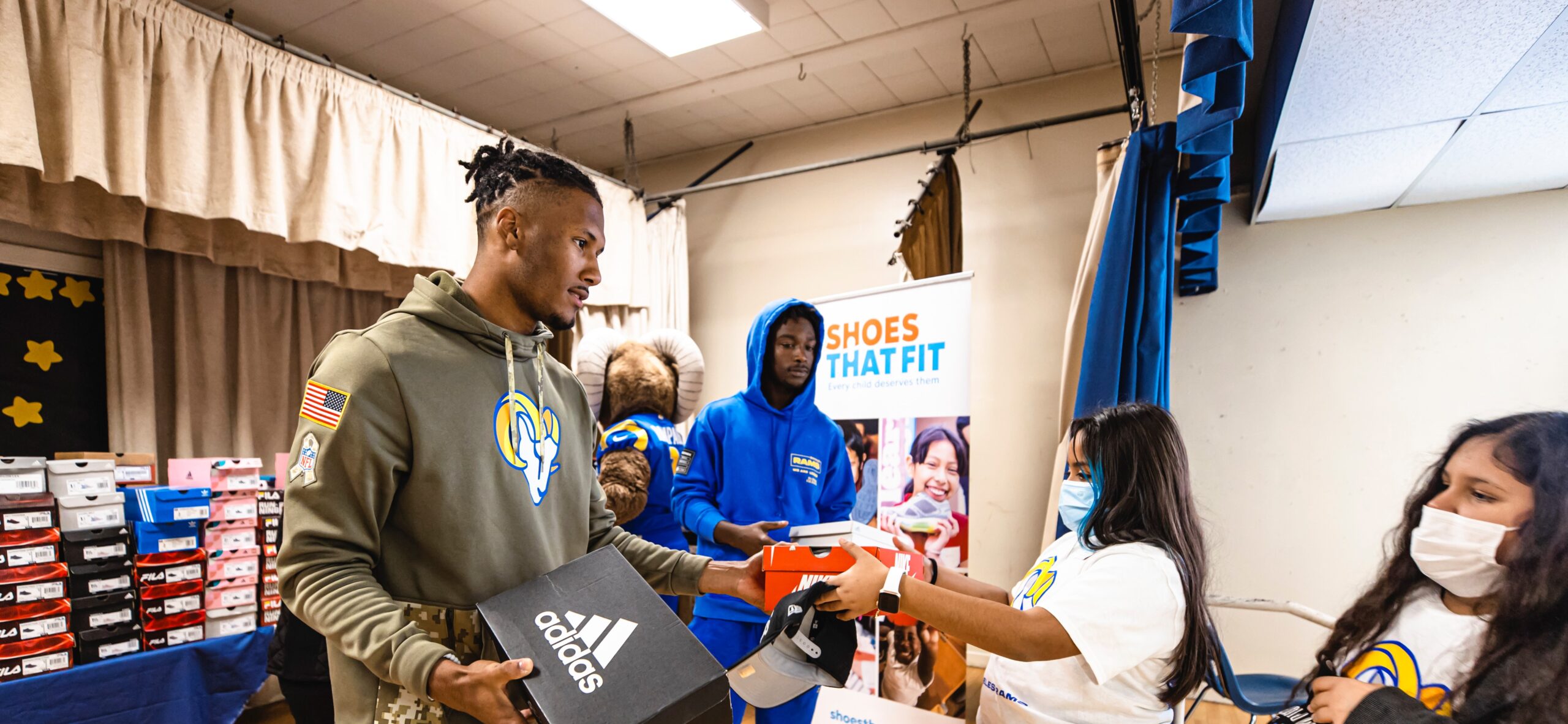 Rams bring shoes and sports to 400 kids!