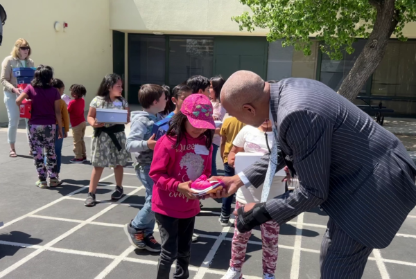 Students in Fresno get new shoes and show them off to the principal